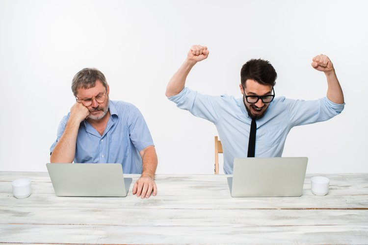 the-two-colleagues-working-together-at-office.jpg